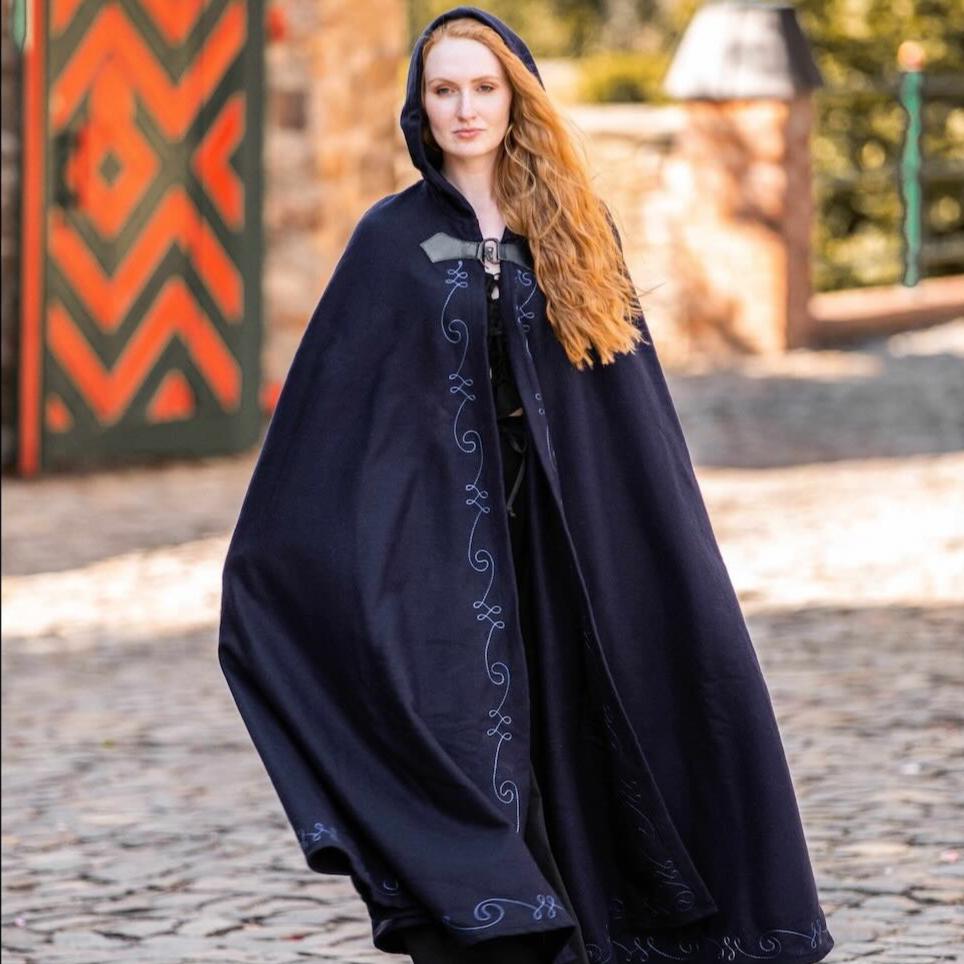 Pirate hooded navy wool cloak with light blue embroidery and a wolf head clasp.