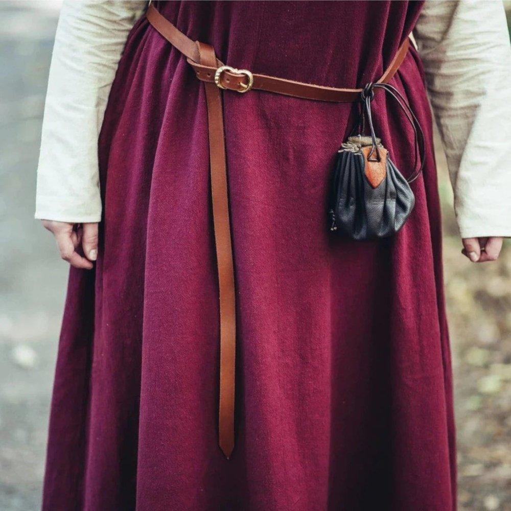 Brown genuine leather Pirate belt with brass-coated buckle, cinching a burgundy dress and holding a small pouch.