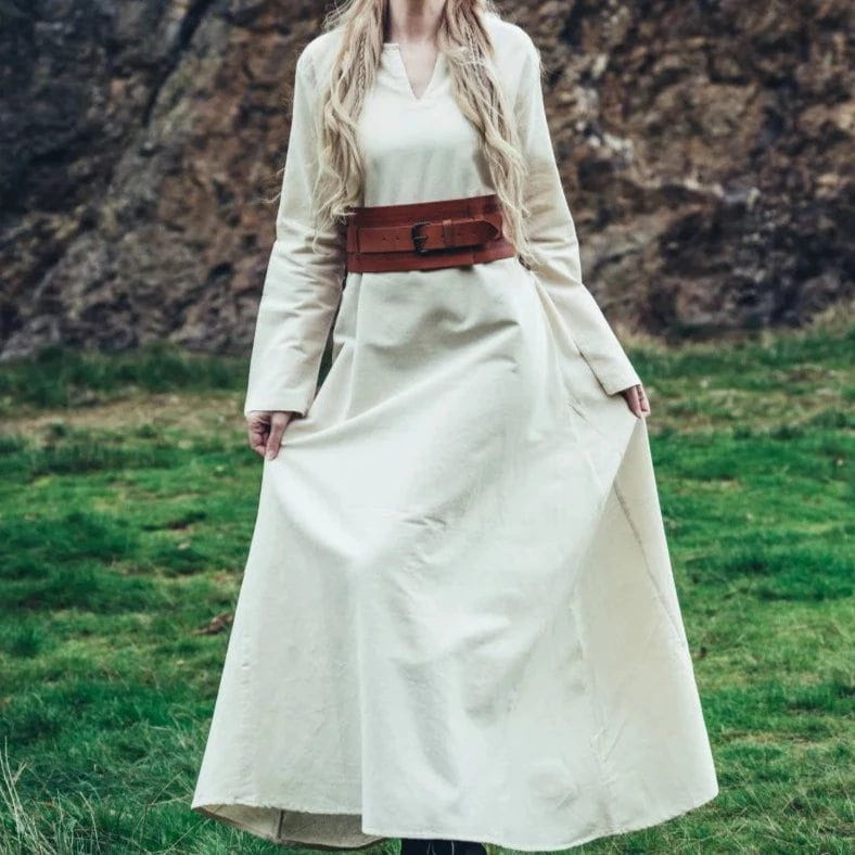 Natural cotton Pirate underdress with long sleeves, V-neck, and a wide brown leather belt.