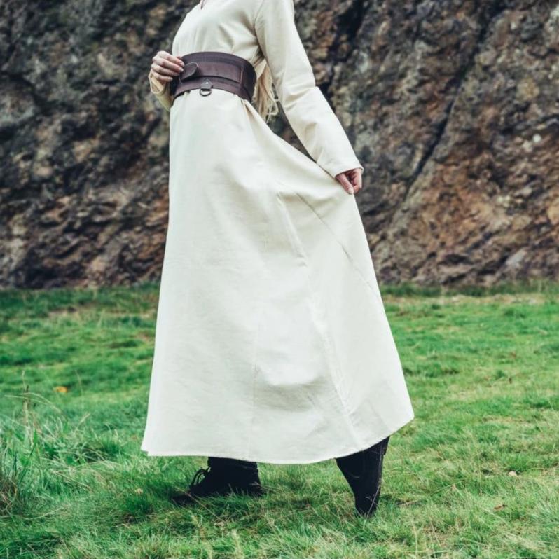Natural cotton Pirate underdress, long-sleeved, cream-colored, with a brown leather belt.