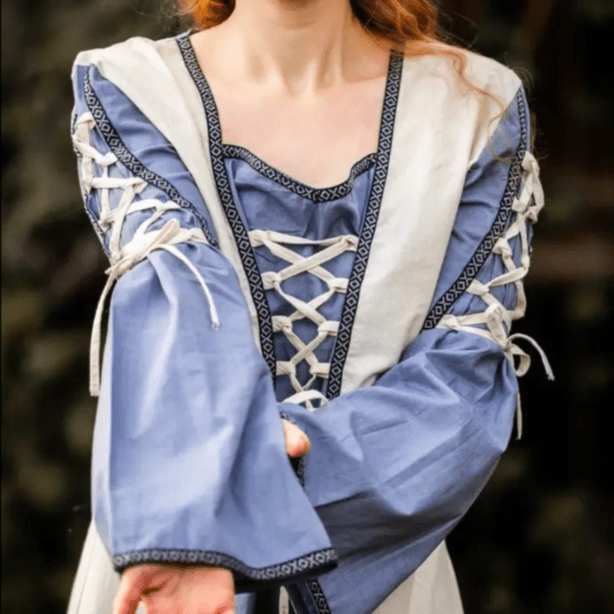Natural and blue Pirate gown with laced cuffs, V-neck, floral borders, and open trumpet sleeves.