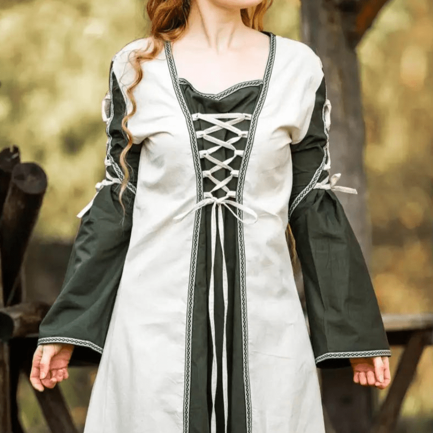Natural and green Pirate gown with laced V-neckline, trumpet sleeves, and floral border.