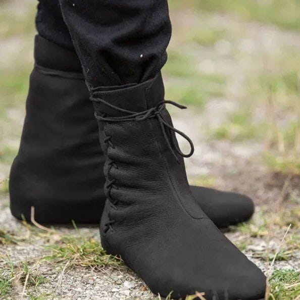 Black vegan leather low-cut Pirate boots with lace-tied button-up lacing and hard rubber soles.