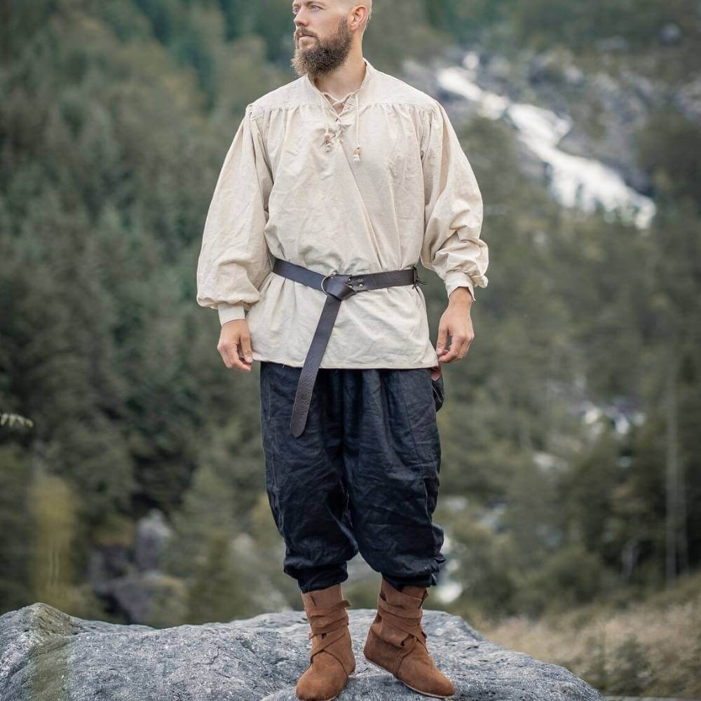 Pirate shirt in natural white with lace-up collar, worn by a man with a belt and dark breeches.