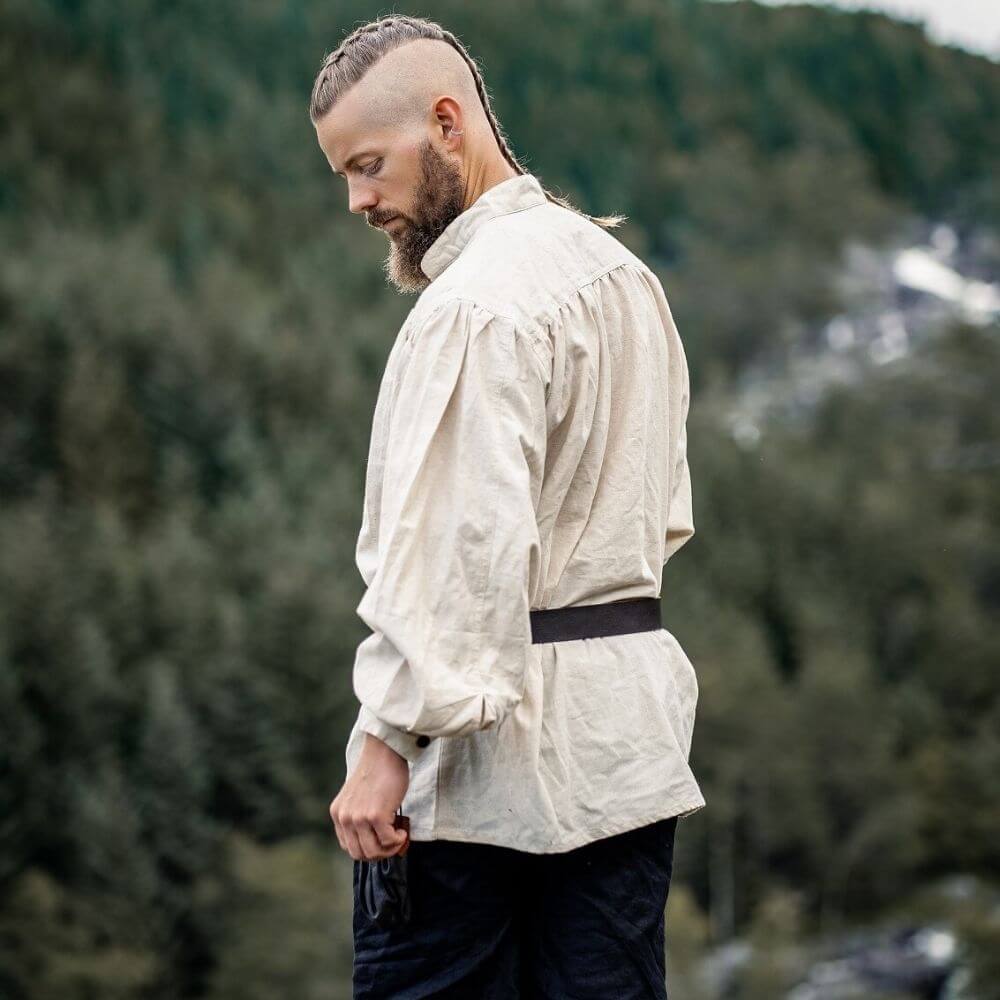 Natural white pirate shirt with lace-up collar, worn by a man with a beard and braided hair.