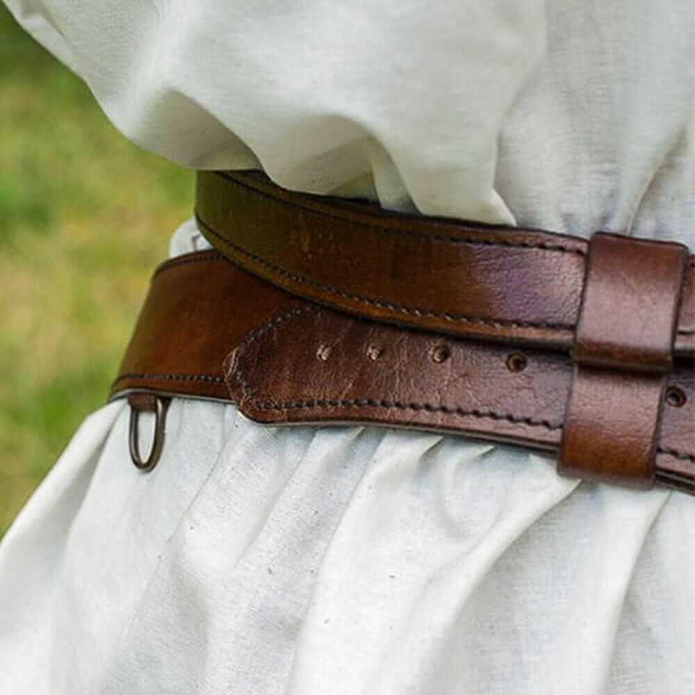 Brown genuine leather Pirate sword belt with brass buckles and adjustable straps over a white tunic.