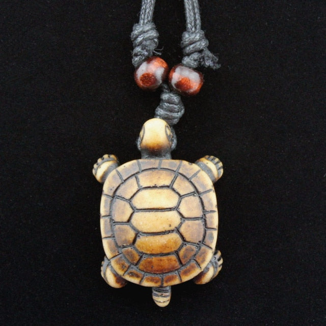 Amazon.com: Earthbound Pacific Hand Carved Solid Aged Bone Hawaiian Sea Turtle  Necklace with Scrimshaw: Clothing, Shoes & Jewelry
