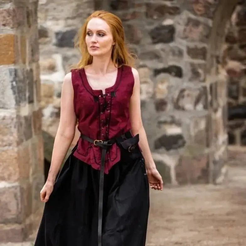 Red cotton Pirate wench bodice with front lacing and embroidery, worn over a black skirt.