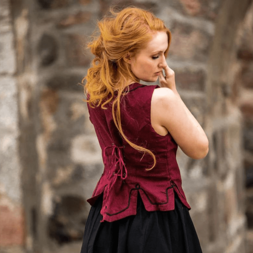 Red cotton Pirate wench bodice with back lacing and embroidered details, worn by a redhead.