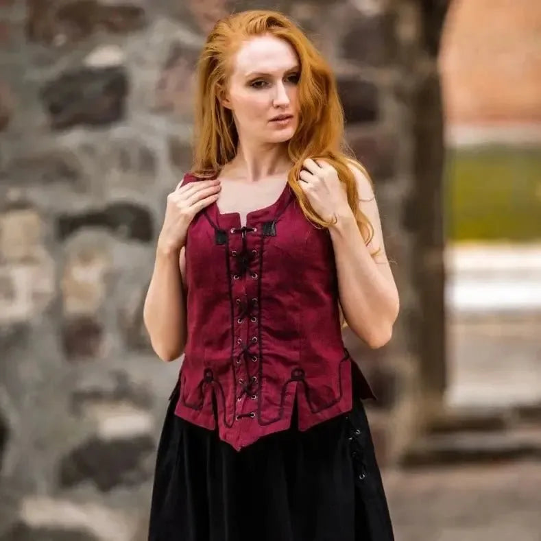Red cotton Pirate wench bodice with front lacing and embroidery, worn by a woman.