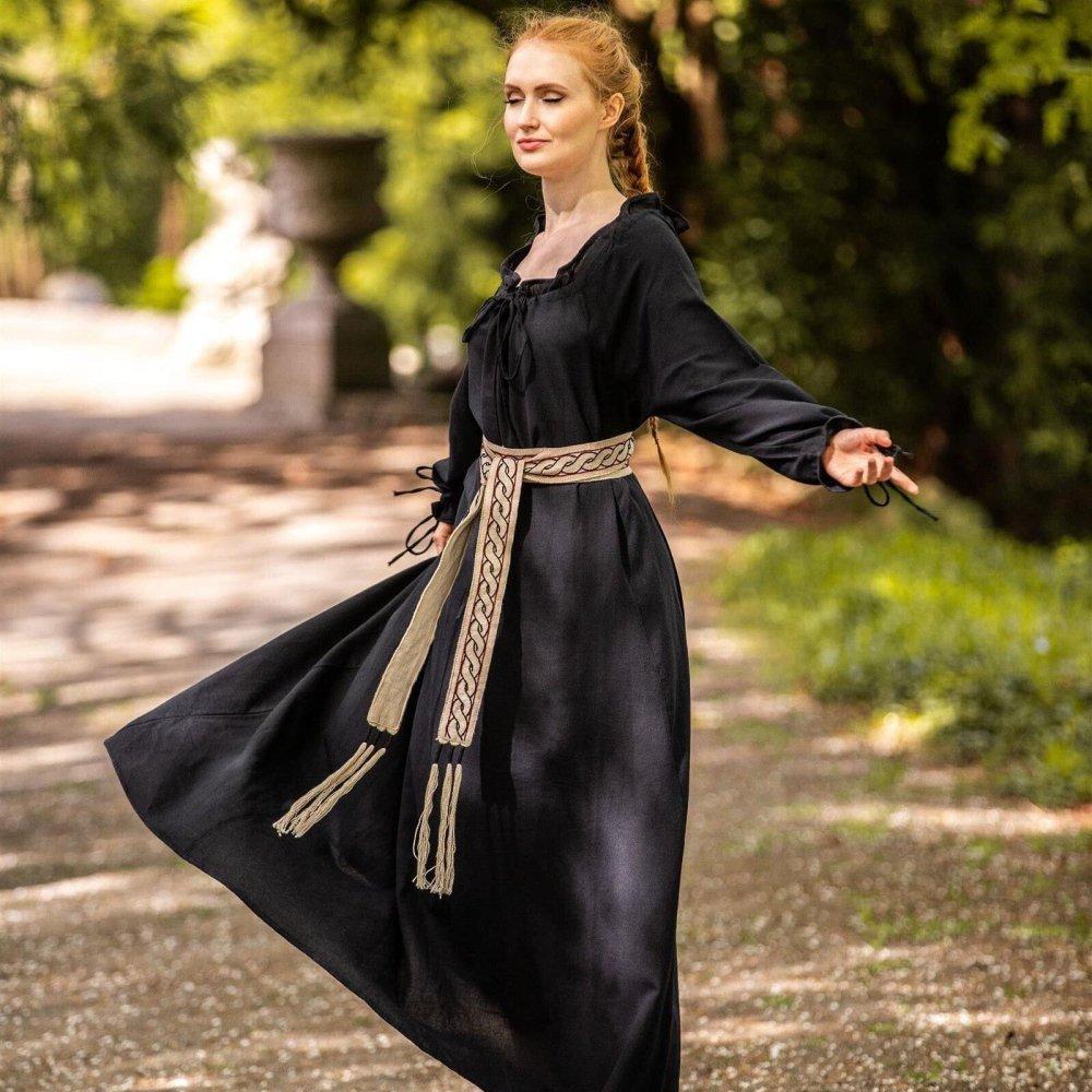 Woman in a black Pirate dress with a woven beige and brown tie belt.