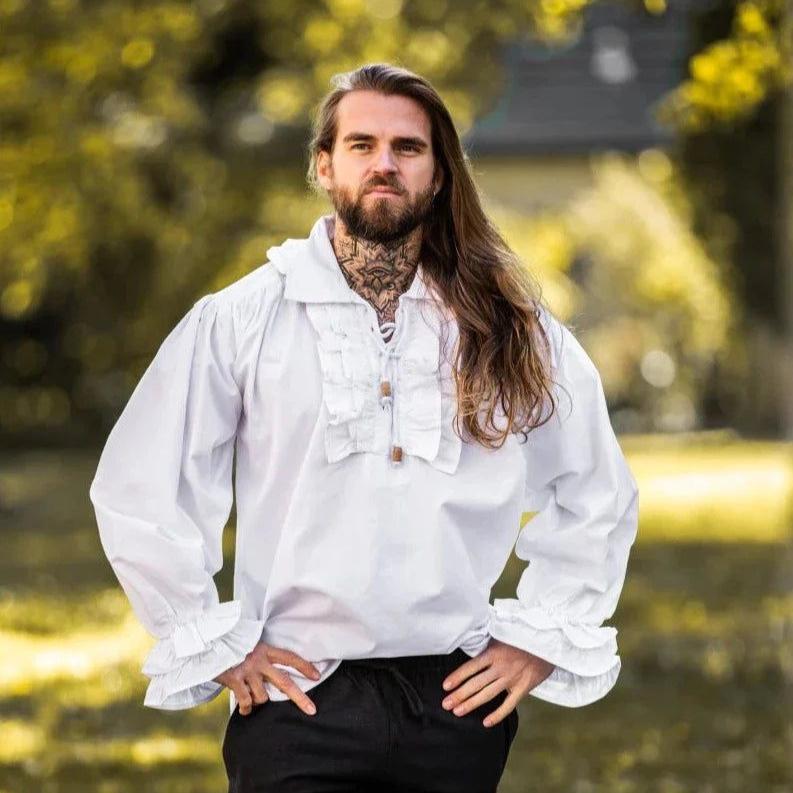 Man in white cotton Pirate shirt with ruffles, puffed sleeves, and wooden buttons.