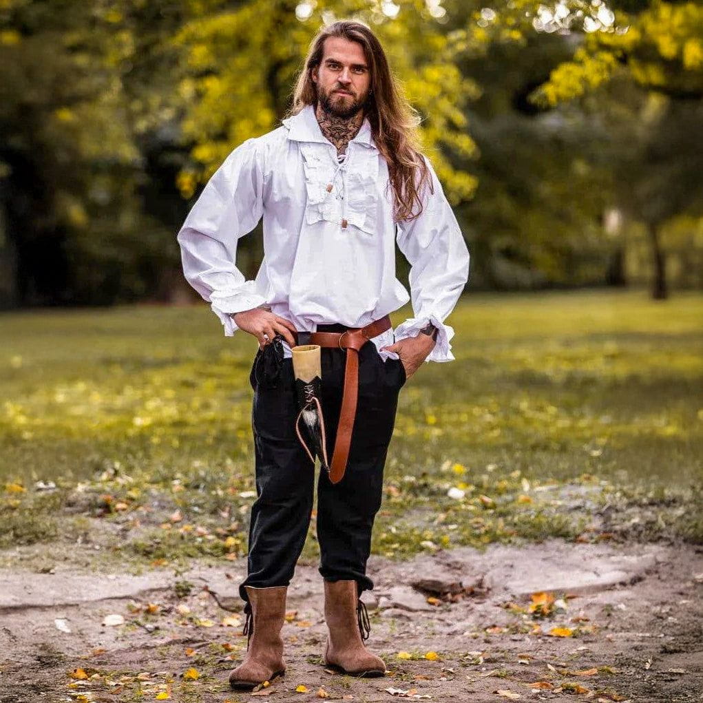 Man in white cotton Pirate shirt with ruffles, puffed sleeves, and brown belt.