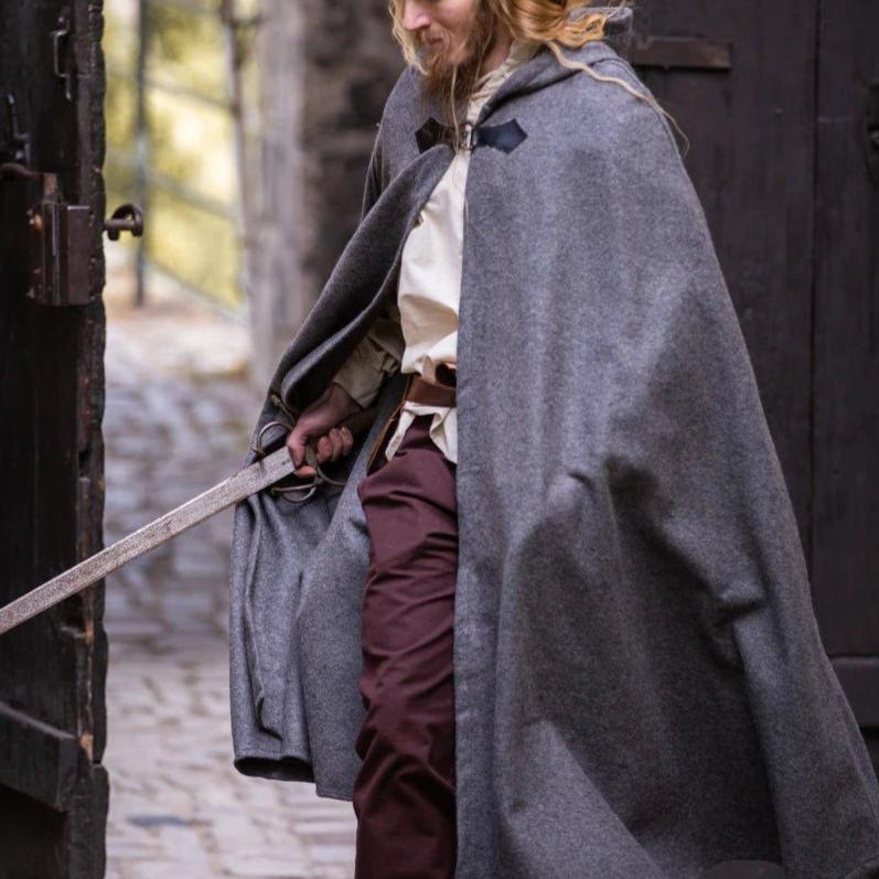 Gray wool Pirate cloak with wolf clasp, short hood, and sword.