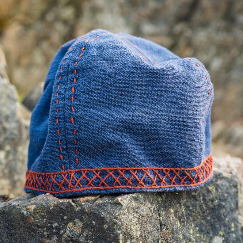 Man wearing blue cotton Pirate cap with red embroidered band