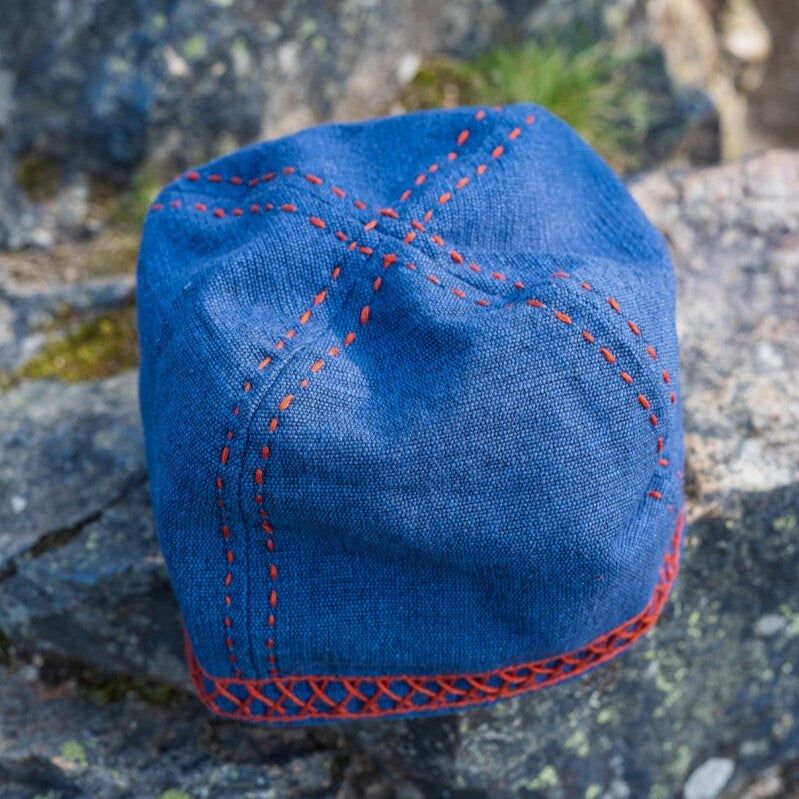 Blue cotton Pirate cap with visible panel seams and red band