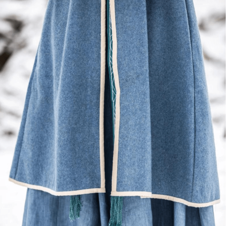 Two wooden toggle buttons on the front of a blue wool coat