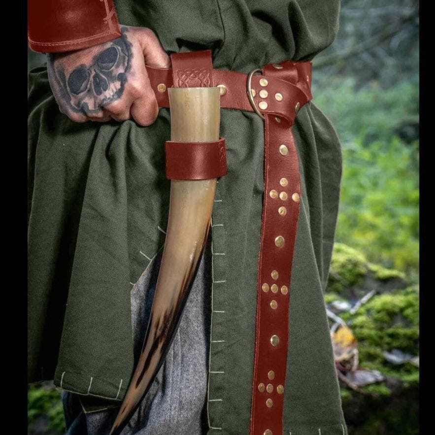 Brown riveted leather pirate belt with a metal ring loop tied in a knot
