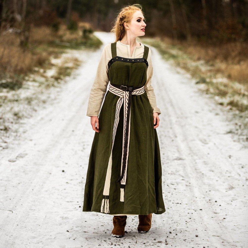 Woman wearing a green linen pirate over dress, front view