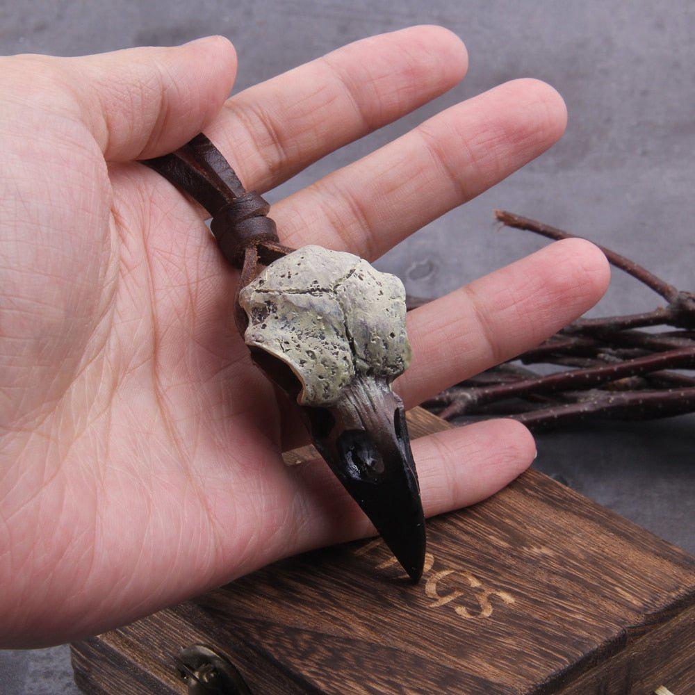 Raven skull necklace laid flat showing full cord length