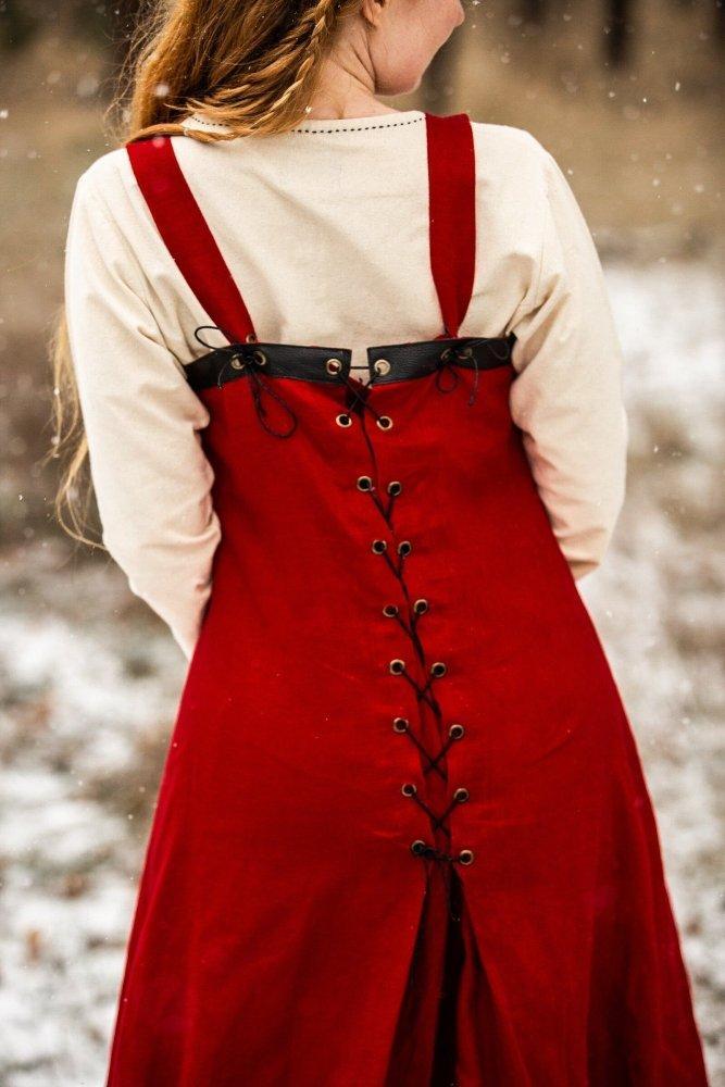 Red linen apron style over dress, side view