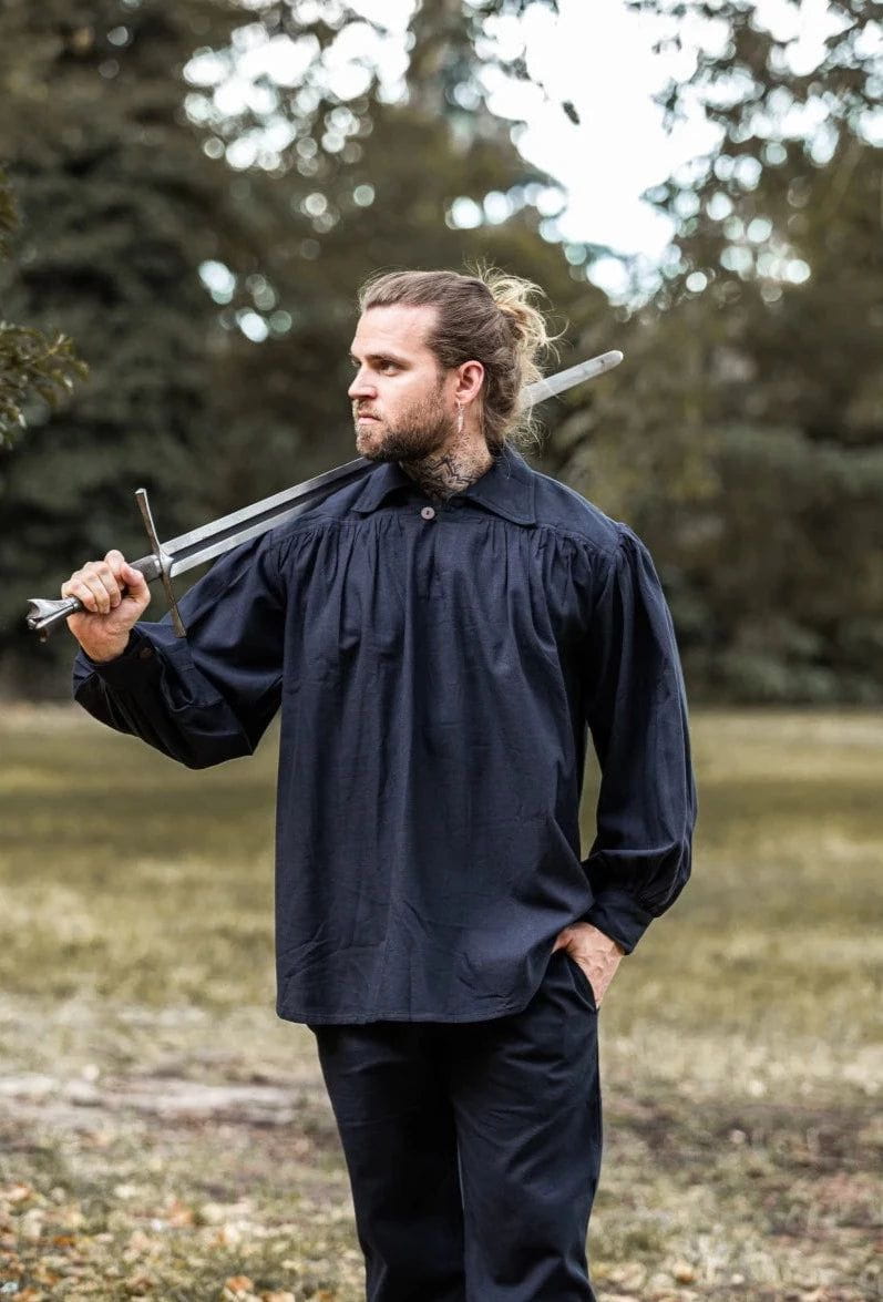 Man in a dark blue Pirate cotton shirt with wooden buttons, holding a sword.