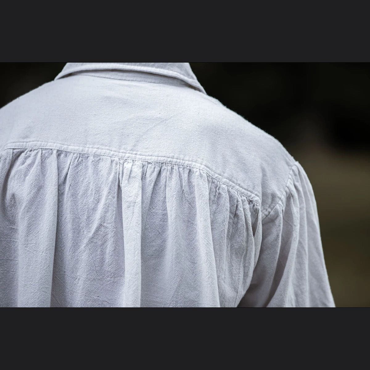 White cotton Pirate shirt with a loose fit and gathered back detail.