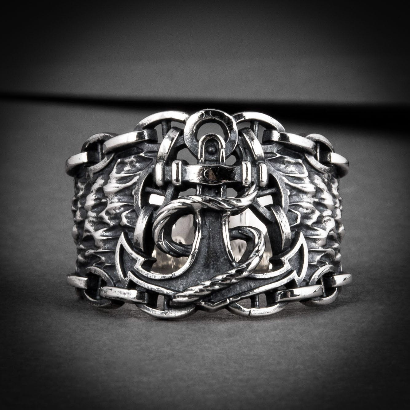 Pirate sterling silver ring with detailed anchor, rope, and chain design.