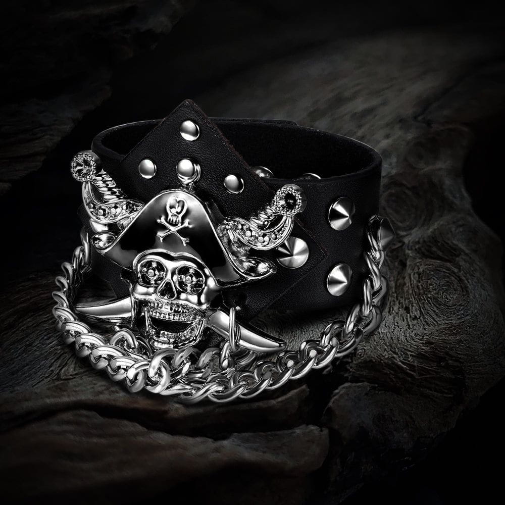 Pirate skull riveted black leather cuff bracelet with silver alloy chain and crossed swords design.