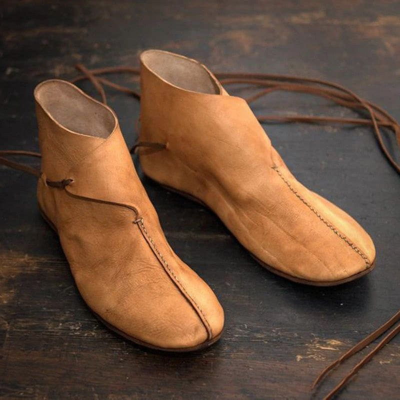 Pair of light brown faux leather Pirate short deck boots with low-cut ankle design and laces.