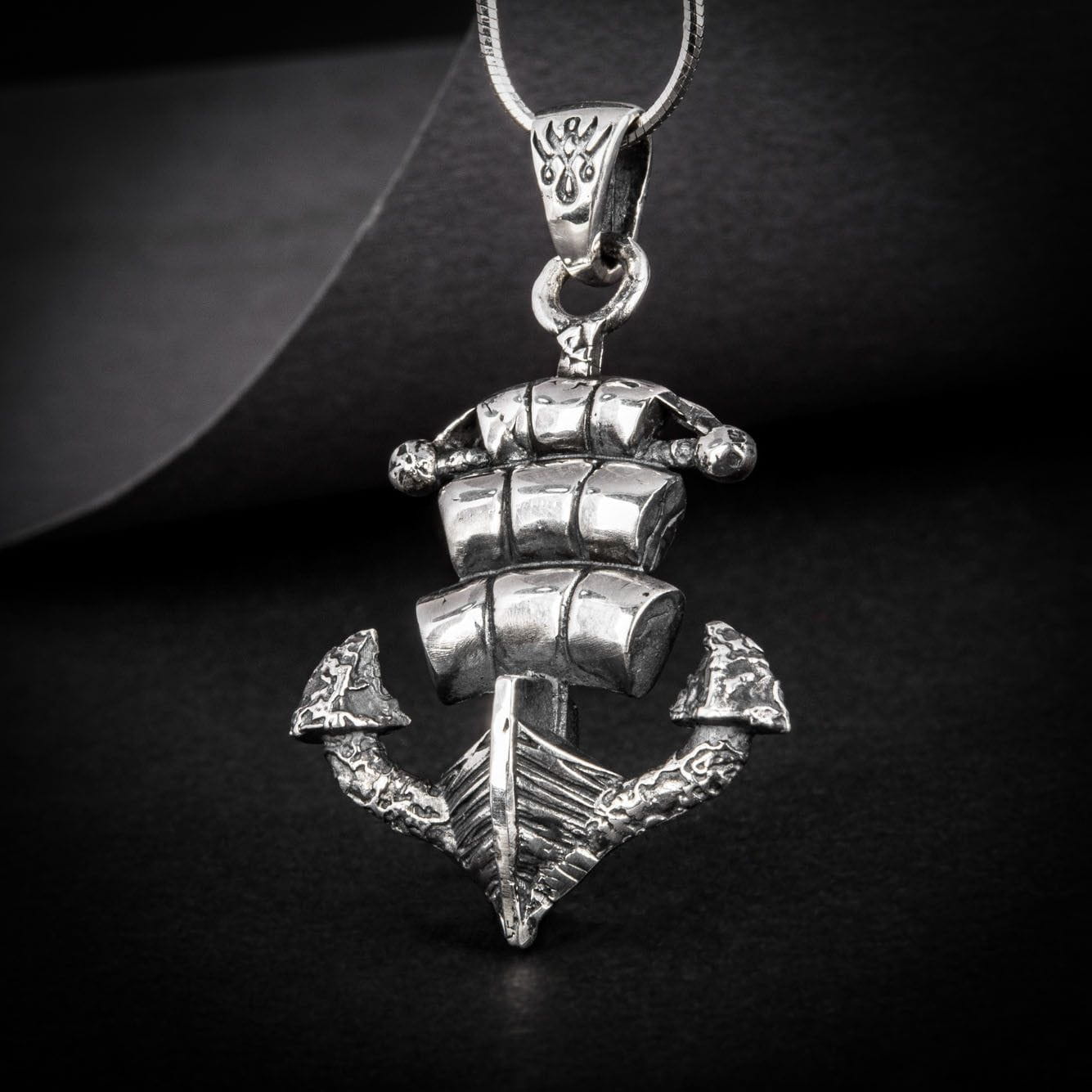 Polished sterling silver Pirate ship and anchor pendant with chain.